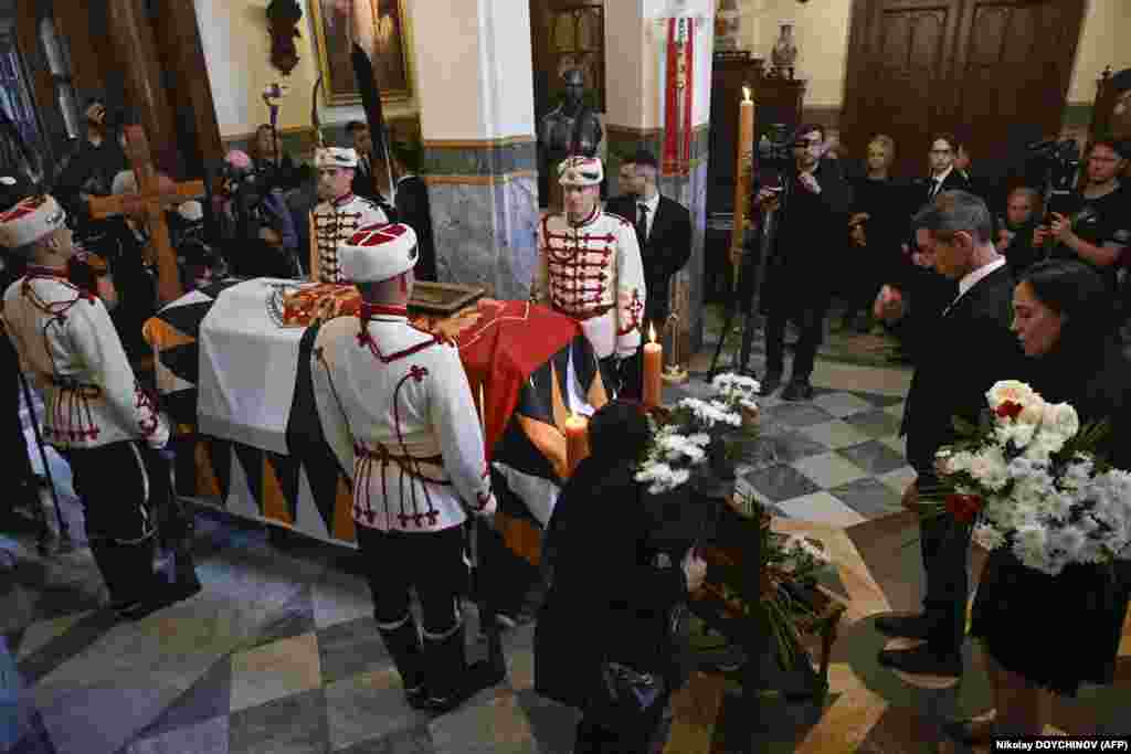 Attendees pay their respects to the late King Ferdinand I of Bulgaria during the funeral ceremony at Vrana Royal Palace in Sofia.