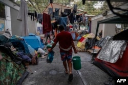 Импровизированный лагерь мигрантов, собирающихся попасть в США, на окраине мексиканской столицы. Мехико, март 2024 года