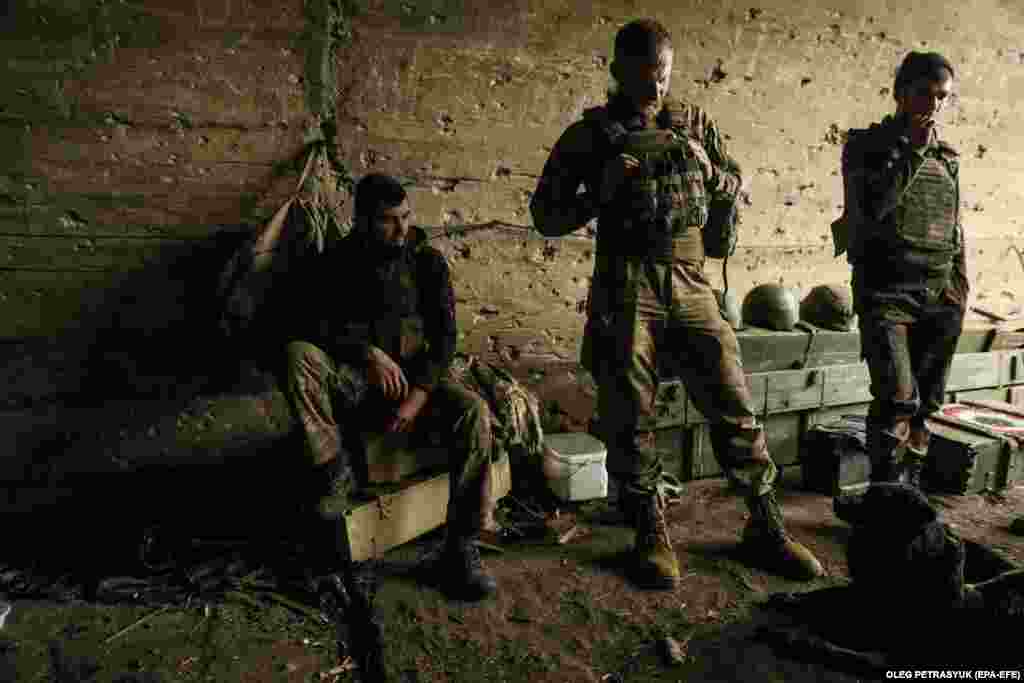 Members of the 10th Separate Mountain Assault Brigade Edelweiss, a unit of the Ukrainian ground forces, rest at an undisclosed location in the Bakhmut area.