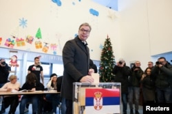 Serbian President Aleksandar Vucic casts his vote at a polling station during the parliamentary election in Belgrade on December 17. He has insisted his SNS won fair and square.
