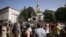 A crowd gathers ton protest outside a Russian Orthodox church in Sofia on September 24. 