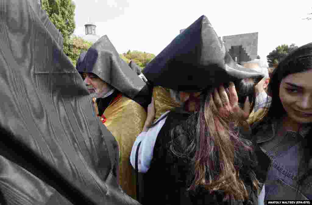 An Armenian woman embraces a monk during the ceremony.&nbsp; On September 19, Azerbaijan launched a military operation in Nagorno-Karabakh following a months-long blockade of the breakaway territory.