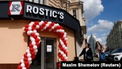 People walk past a former KFC restaurant reopened as Rostic's in Moscow on April 25. 