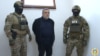Former senior Nagorno-Karabakh official Ruben Vardanian (center) in Azerbaijani custody in Baku. 