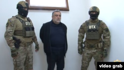 Former senior Nagorno-Karabakh official Ruben Vardanian (center) in Azerbaijani custody in Baku. 