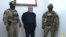 Former senior Nagorno-Karabakh official Ruben Vardanian (center) in Azerbaijani custody in Baku. 