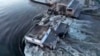 Кадр из видео последствий разрушения дамбы Каховской ГЭС, опубликованного 6 июня 2023 года президентом Владимиром Зеленским. Власти Украины обвинили в подрыве дамбы гидроэлектростанции российскую армию
