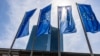 European flags fly in front of the European Central Bank in Frankfurt am Main, Germany. 