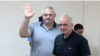 Armenia - Former Vanadzor Mayor Mamikon Aslanian (left) greets supporters during his trial in Yerevan, June 15, 2023.