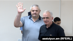 Armenia - Former Vanadzor Mayor Mamikon Aslanian (left) greets supporters during his trial in Yerevan, June 15, 2023.