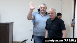 Armenia - Former Vanadzor Mayor Mamikon Aslanian (left) greets supporters during his trial in Yerevan, June 15, 2023.
