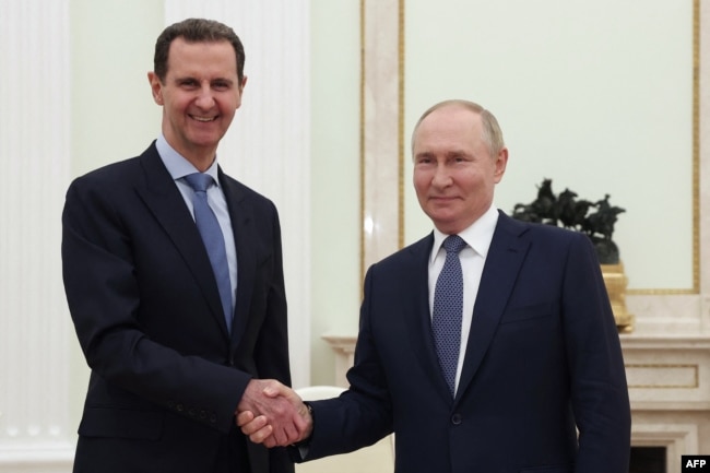 Bashar al-Assad (left) and Vladimir Putin meet in Moscow in July.