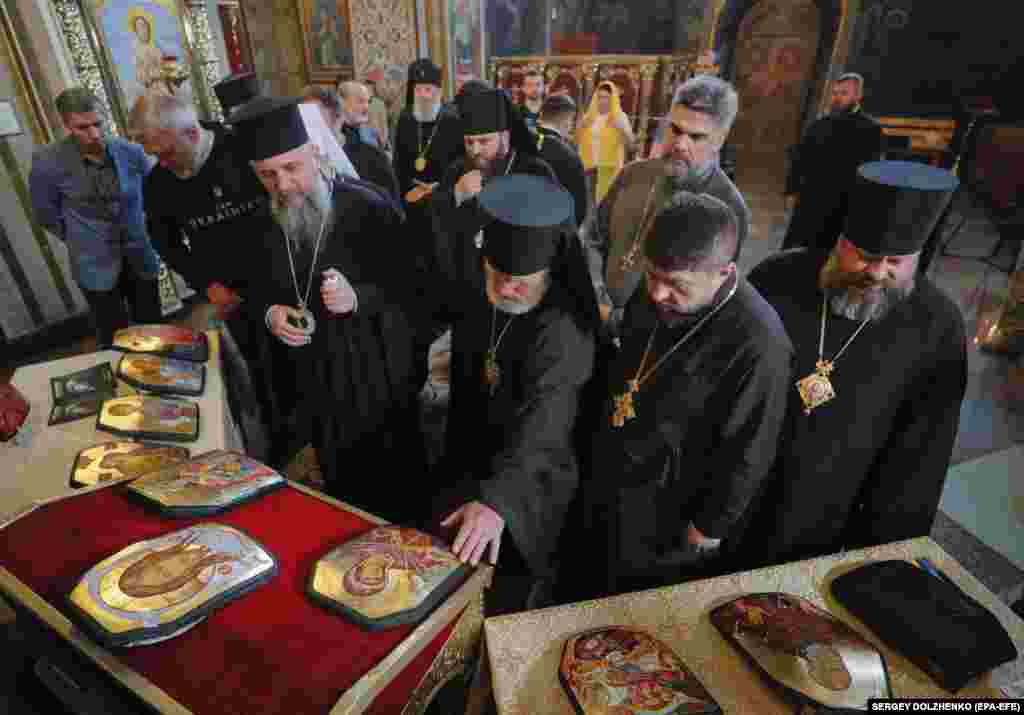 Epiphanius I along with other clergy members review the icons.