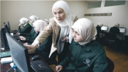 Girls study at the Sayida Khadijah madrasah in Osh Province, Kyrgyzstan.