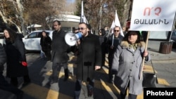 Armenia - Opposition members of the city council protest against a proposed suge in parking fees in central Yerevan, December 19, 2023.