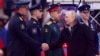 Russian President Vladimir Putin greets military officers at an open-air concert and rally titled "Glory to Defenders of Our Fatherland" on February 22, on the eve of the country's annual day for celebrating its armed forces and comemorating the establishment of the Red Army. 