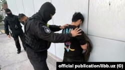 Suspects are detained in Tashkent on April 12.