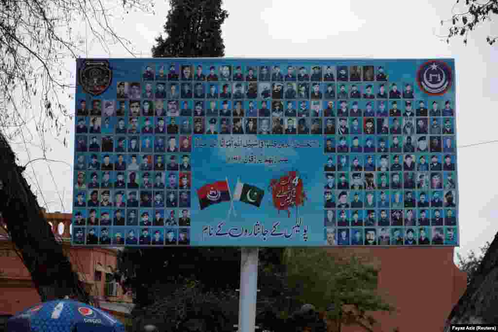 A billboard in Peshawar with the faces of police officers who died in the line of duty.