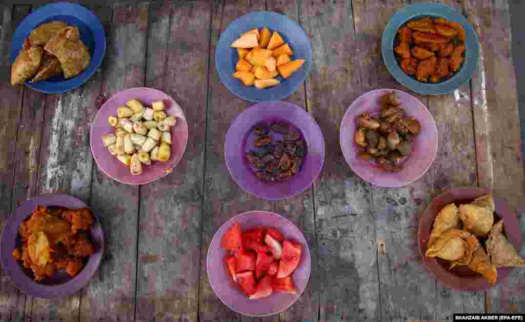 An iftar meal in Karachi, Pakistan, on March 26 awaits the faithful who have been fasting. Muslims around the world celebrate Ramadan, the holiest month of the Islamic calendar, by praying during the night and abstaining from eating, drinking, and sexual activity during the period between sunrise and sunset.