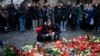 Mourners lay candle lights outside the headquarters of Charles University on December 22 for victims of a mass shooting in Prague the day before. 