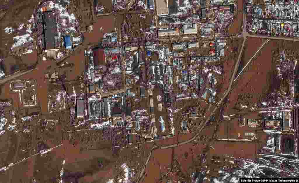 A satellite image released by Maxar Technologies shows floodwaters in the Russian city of Orenburg on April 9. Russia is struggling to contain flooding resulting from swiftly melting snow and a dam breach in the city of Orsk in the Ural Mountains.