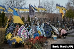 Ukrainian military graves at a cemetery outside Kyiv in March