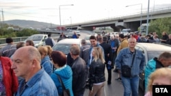 Energy sector workers block a road as part of protests that were held in Bulgaria on September 29. 