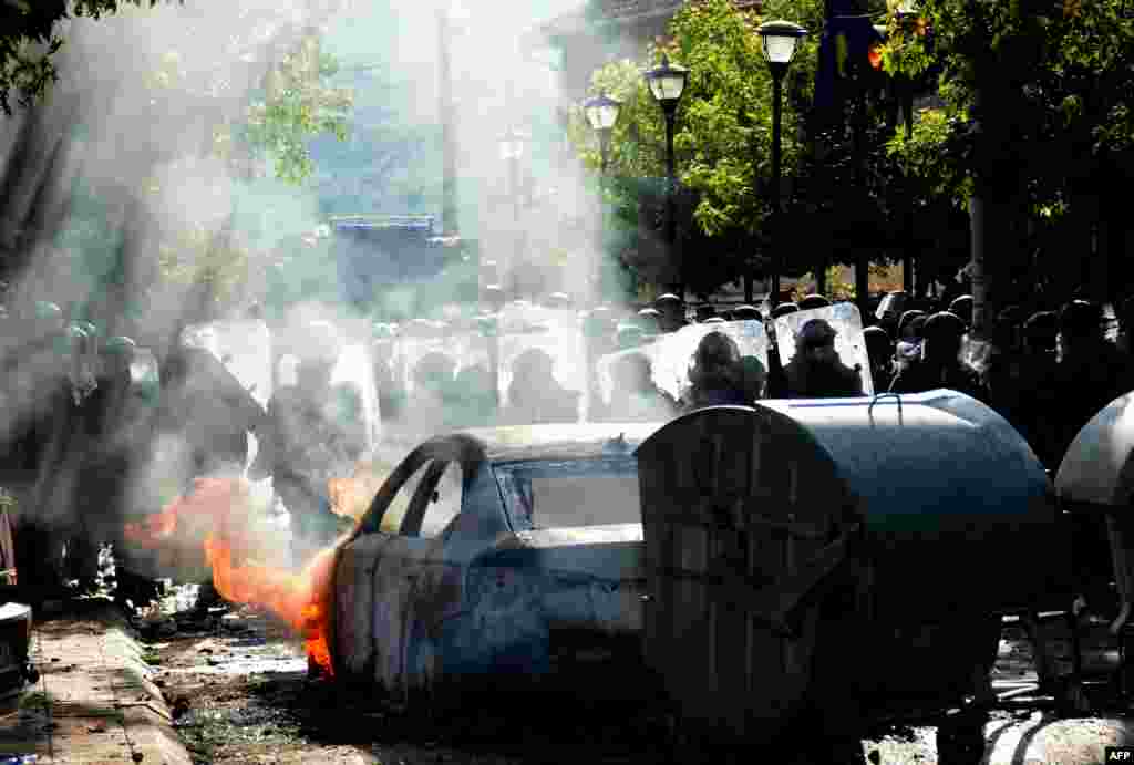 Kosovo riot police and KFOR troops secure the area around the Zvecan municipal headquarters.