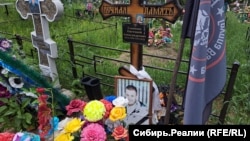 Yevgeny Sayapin's grave in Yashkino, where he was killed 11 days after returning from the front in Ukraine.