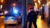 A police officer secures the area following the shooting at one of the buildings of Charles University in Prague