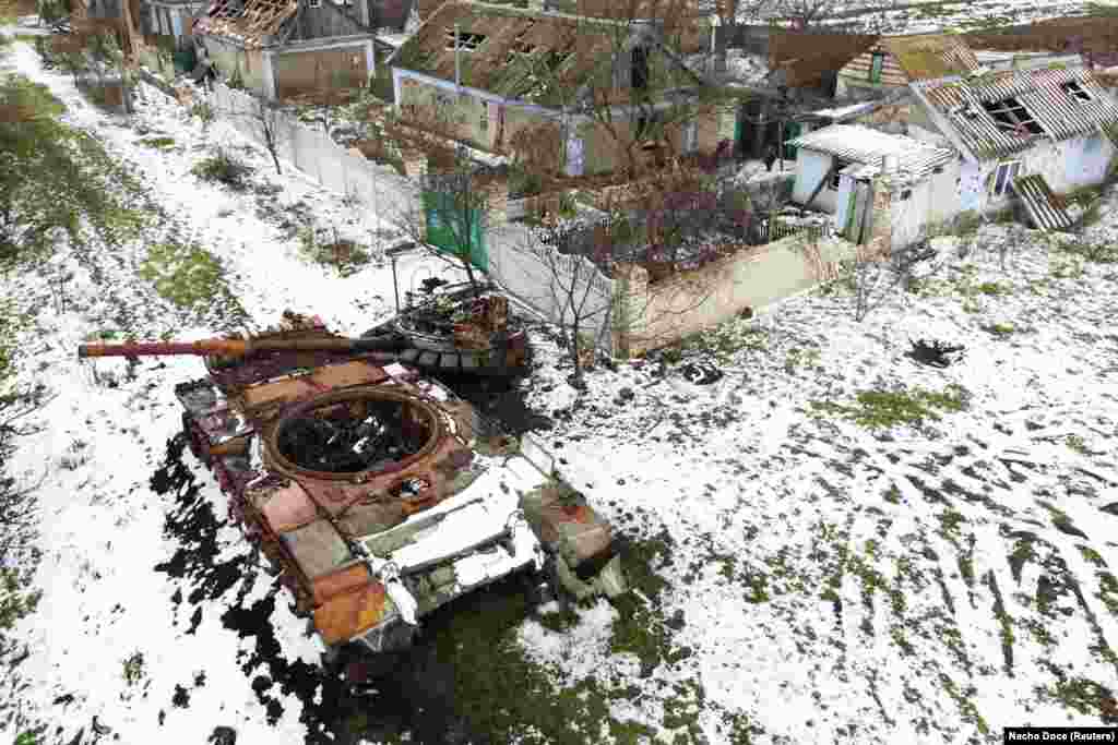 A destroyed Russian tank rusts near the Kovalyov brothers&#39; destroyed homes. The clashes coincided with a Ukrainian counteroffensive that eventually pushed Moscow&#39;s forces across the Dnieper River.