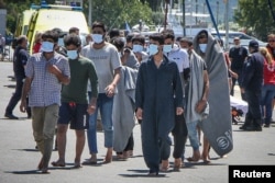 Migrantlar Gresiýanyň Kalamata portuna gelýärler. 2023-nji ýylyň 14-nji iýuny