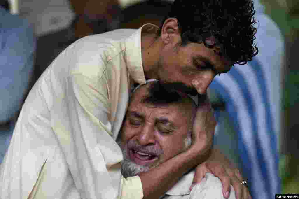 A man cries outside the mortuary after he lost his son in monsoon rains on the outskirts of Islamabad.