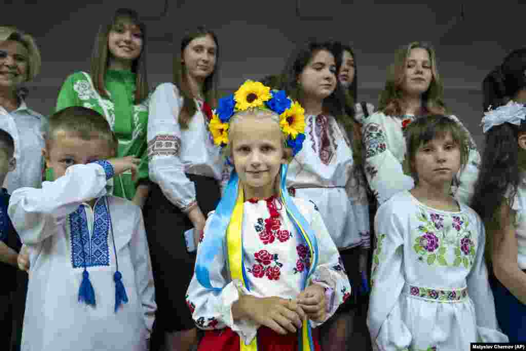 Schoolchildren attend a ceremony on the first day at school in Kharkiv on September 1. Ukraine marks September 1 as Knowledge Day, a traditional launch of the academic year. Most of the children wear traditional &quot;vysivanka&quot; shirts.