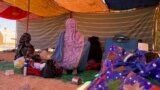 Wadi Halfa, Sudan -- A family in a tent in a small town packed with IDPs from Khartoum