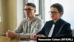 Marin Pavlescu attends a court session with his lawyer Doina Straisteanu in Chisinau on November 29.