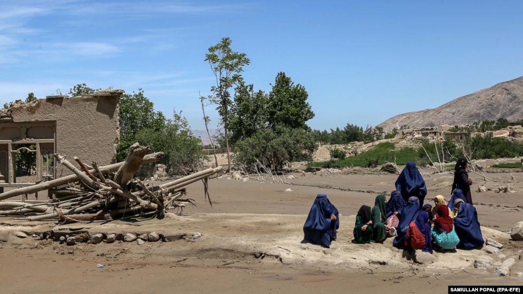 Women gather after flash floods in the village of Borka in the northern province of Baghlan in May.