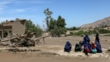 Women gather after flash floods in the village of Borka in the northern province of Baghlan in May.