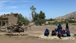 Women gather after flash floods in the village of Borka in the northern province of Baghlan in May.