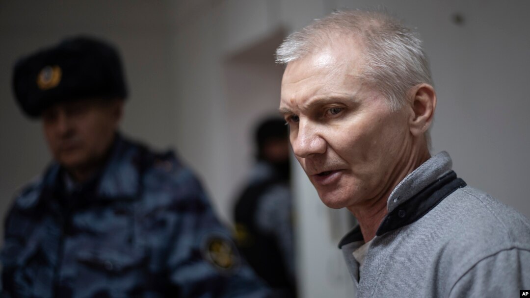 Aleksei Moskalyov is escorted from a courtroom in Yefremov in Russia's Tula region, some 300 kilometers south of Moscow, on March 27.