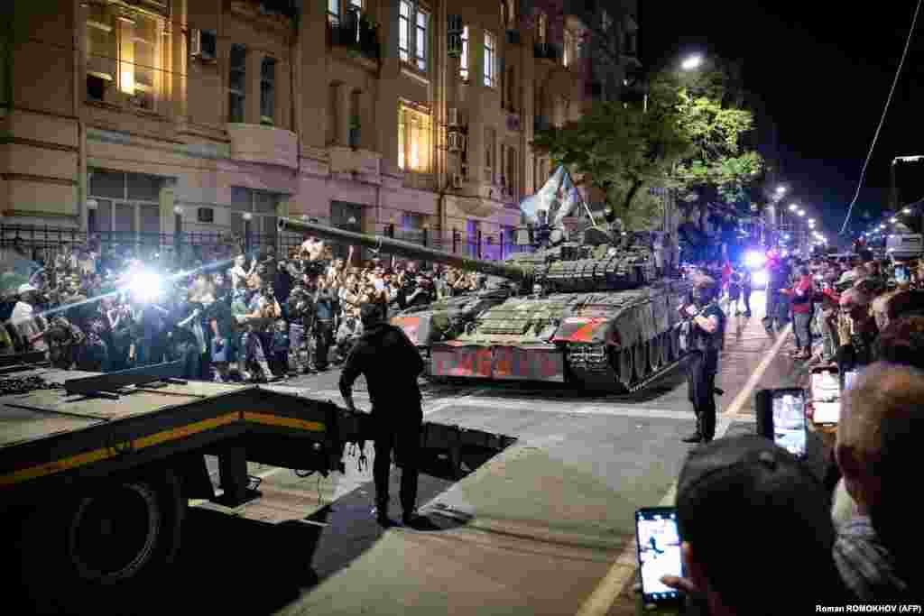 Members of the Wagner Group prepare to pull out from the headquarters of the Southern Military District in Rostov-on-Don to return to their base late on June 24. Russia&rsquo;s Federal Security Service announced a criminal case against Prigozhin for &ldquo;incitement to armed rebellion&rdquo; after he vowed to lead a &ldquo;march of justice&rdquo; against top officials in Russia&rsquo;s Defense Ministry. &nbsp;