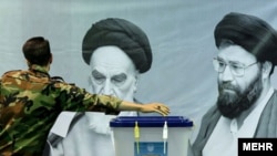 A man casts his vote in the presidential election in Tehran on June 28.