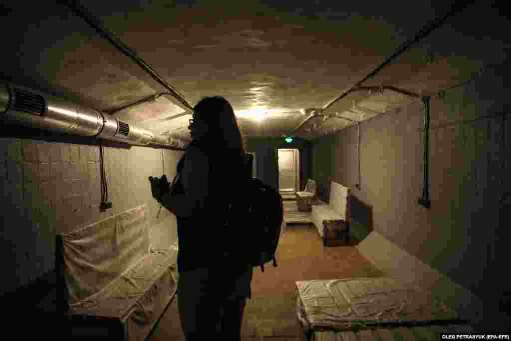 Mira, 17, visits a bomb shelter close to her home, in Kyiv.