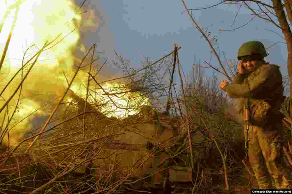 A Ukrainian soldier near Bakhmut fires a self-propelled howitzer toward Russian positions. Capturing Chasiv Yar would also open the way for Moscow&#39;s forces to advance toward two other cities in the Donetsk region -- Kramatorsk and Slovyansk.