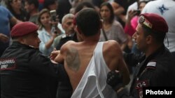 Armenia - Riot police detain a protester in Yerevan, May 31, 2024.