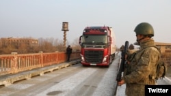 Turkey/Armenia - An Armenian truck loaded with humanitarian aid for earthquake victims crosses a Turkish-Armenian border bridge near Margara, February 11, 2023.