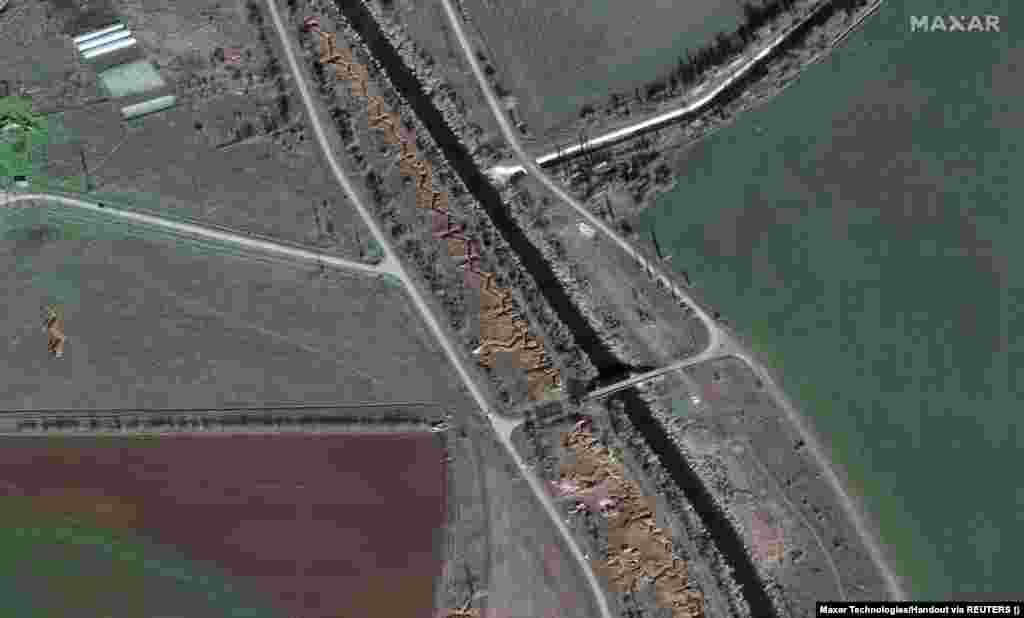 Fortifications and dragon&#39;s teeth (wedge-shaped concrete anti-tank barriers laid in multiple rows) are visible in Maslove, northern Crimea. The Russian military has reinforced several areas of Crimea, as can be seen in satellite photographs taken between January and March.