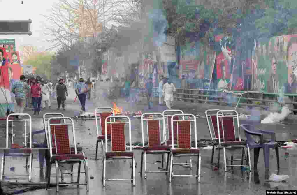 Supporters set fires and blocked roads during the clashes with police, who fired tear gas and water cannons at the stone-pelting crowds. Two courts in Islamabad on March 13 issued arrest warrants for Khan over his failure to appear before judges in the graft case. &nbsp;