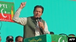 Former Pakistani Prime Minister Imran Khan addresses supporters of his Pakistan Tehrik-e Insaf (PTI) party during a public rally in Abbottabad in May 2022. 