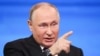 Russian President Vladimir Putin speaks at a televised question-and-answer session on December 14.